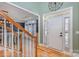A welcoming foyer with hardwood floors and a staircase leading to the upper level at 158 Crimson Orchard Dr, Mooresville, NC 28115