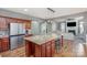 Open concept kitchen with stainless steel appliances, a large island, and an adjoining living space at 158 Crimson Orchard Dr, Mooresville, NC 28115