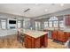 Open concept kitchen featuring a large island with seating and stainless steel appliances at 158 Crimson Orchard Dr, Mooresville, NC 28115