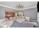 Bright living room open to the kitchen with a large sectional sofa at 158 Crimson Orchard Dr, Mooresville, NC 28115