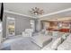 Open-concept living room with fireplace, ceiling fan, and seamless kitchen access at 158 Crimson Orchard Dr, Mooresville, NC 28115