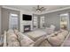 Inviting living room with a fireplace, large sectional sofa, and plenty of natural light at 158 Crimson Orchard Dr, Mooresville, NC 28115