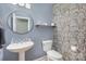 Stylish powder room with unique wallpaper and pedestal sink at 158 Crimson Orchard Dr, Mooresville, NC 28115