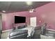 Home theater with reclining seats and projector screen for entertainment at 158 Crimson Orchard Dr, Mooresville, NC 28115