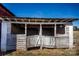 Exterior of barn with weathered wood and doors under a clear blue sky at 169 Eagle Mills Rd, Harmony, NC 28634