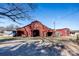 Classic red barn with white accents, and mature trees at 169 Eagle Mills Rd, Harmony, NC 28634