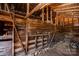 Barn interior with wooden walls and rafters plus dirt floor at 169 Eagle Mills Rd, Harmony, NC 28634