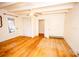 Bright bedroom with hardwood floors, white walls, ceiling fan, and closet at 169 Eagle Mills Rd, Harmony, NC 28634