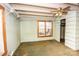 Small bedroom with closet has a ceiling fan and natural light; awaiting your unique style at 169 Eagle Mills Rd, Harmony, NC 28634