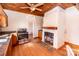 Cozy kitchen features wood floors, a fireplace, and an eat-in area; perfect for casual dining at 169 Eagle Mills Rd, Harmony, NC 28634