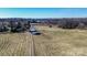 Aerial view of property showing acreage, long driveway and outbuildings at 169 Eagle Mills Rd, Harmony, NC 28634