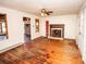 Spacious living room with hardwood floors, fireplace, and an open layout at 169 Eagle Mills Rd, Harmony, NC 28634