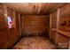 Unfinished room featuring rustic wood walls, ceiling, and a small stained-glass window at 169 Eagle Mills Rd, Harmony, NC 28634