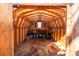Interior view of a wooden shed with workbench and blue storage bins at 169 Eagle Mills Rd, Harmony, NC 28634