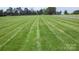 Beautifully maintained lawn with striping at 169 Eagle Mills Rd, Harmony, NC 28634
