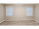 Clean bedroom featuring neutral walls, carpet, and good natural light from bright windows at 1766 15Th Street Ne Pl, Hickory, NC 28601