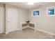Bedroom with neutral walls, carpet, built-in desk, and good natural light from bright windows at 1766 15Th Street Ne Pl, Hickory, NC 28601