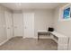 Bedroom with neutral walls, carpet, modern built-in desk, and good natural light from a bright window at 1766 15Th Street Ne Pl, Hickory, NC 28601