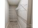 Walk-in closet features wire shelving for easy organization and neutral walls with carpet at 1766 15Th Street Ne Pl, Hickory, NC 28601