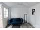 Cozy interior of the shed featuring a modern couch, a mirror, and an open doorway at 1766 15Th Street Ne Pl, Hickory, NC 28601