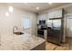 Bright kitchen featuring a granite island, stainless steel appliances, and modern cabinetry at 1766 15Th Street Ne Pl, Hickory, NC 28601
