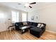 Cozy living room featuring hardwood floors, natural light, and a comfortable sectional sofa at 1766 15Th Street Ne Pl, Hickory, NC 28601