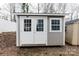 Outdoor shed has double doors, a window, and neutral color siding at 1766 15Th Street Ne Pl, Hickory, NC 28601