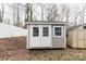 Outdoor shed has double doors, a window, and neutral color siding at 1766 15Th Street Ne Pl, Hickory, NC 28601