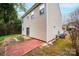 Spacious backyard featuring a small brick patio and mature trees at 1991 9Th Street Se Pl, Hickory, NC 28602