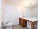 Bathroom features white walls, tile flooring, a vanity with wood cabinets, and a toilet at 1991 9Th Street Se Pl, Hickory, NC 28602