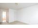 Carpeted room provides natural light through a window and access to another room through an open door at 1991 9Th Street Se Pl, Hickory, NC 28602