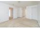 Spacious carpeted room offers multiple doorways, neutral paint, and ample space for furniture arrangement at 1991 9Th Street Se Pl, Hickory, NC 28602