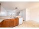 Spacious kitchen featuring wood cabinets, a white dishwasher and plenty of counter space at 1991 9Th Street Se Pl, Hickory, NC 28602