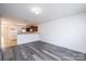 Open-concept living area featuring modern floors and abundant natural light, adjoining the kitchen at 1991 9Th Street Se Pl, Hickory, NC 28602