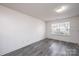 Bright room with hardwood flooring and natural light streaming through a large window at 1991 9Th Street Se Pl, Hickory, NC 28602