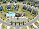 Stunning aerial view of a planned community with a pool, playground, and well-maintained landscaping at 2033 Folkstone Ln, Indian Land, SC 29720