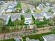 Beautiful aerial view of a neighborhood with well-maintained homes, green spaces, and community pool at 2033 Folkstone Ln, Indian Land, SC 29720