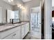 Bathroom with double sinks, granite countertop, and tile flooring at 2033 Folkstone Ln, Indian Land, SC 29720