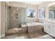 This spacious bathroom features a large shower and soaking tub, with neutral tile at 2033 Folkstone Ln, Indian Land, SC 29720