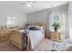 Well lit bedroom featuring a light wood frame bed and matching dressers at 2033 Folkstone Ln, Indian Land, SC 29720