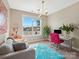 Bright home office featuring a comfortable couch, modern desk, and ample natural light at 2033 Folkstone Ln, Indian Land, SC 29720
