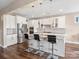 Modern kitchen with white cabinets, stainless steel appliances, and granite countertops with island seating at 2033 Folkstone Ln, Indian Land, SC 29720