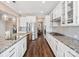 Bright kitchen features granite countertops, stainless steel appliances and white cabinets at 2033 Folkstone Ln, Indian Land, SC 29720