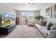 Cozy bonus room featuring a sofa, chair, tv, and a ceiling fan at 2033 Folkstone Ln, Indian Land, SC 29720