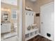Functional entryway with a built-in bench, storage, and adjacent bathroom at 2033 Folkstone Ln, Indian Land, SC 29720