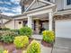 Beautiful two-story home featuring stone accents, a well-manicured lawn, and a welcoming front entrance at 2033 Folkstone Ln, Indian Land, SC 29720
