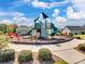 Community playground featuring modern play structures, benches, and well-kept landscaping at 2033 Folkstone Ln, Lancaster, SC 29720
