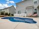 Private backyard pool featuring patio, lounge chairs, and manicured landscaping at 2033 Folkstone Ln, Indian Land, SC 29720