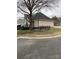 Spacious backyard featuring a wrought iron fence, mature tree and a deck perfect for outdoor enjoyment at 2049 Winding Oak Rd, Rock Hill, SC 29732