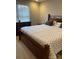Bedroom featuring natural light, a window with blinds, and a bed with gray pillows at 2049 Winding Oak Rd, Rock Hill, SC 29732